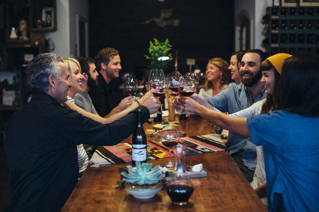 Guests toast their wines at Banshee Tasting Room in Downtown Healdsburg